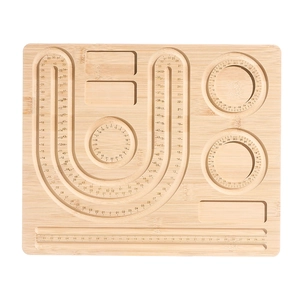 Detailed top view of bamboo bead design board with carved scale ruler and jewelry slots
