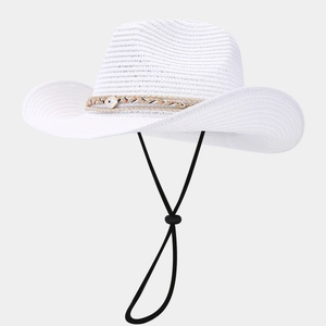 Detail of white woven straw cowboy hat with seashell bead and adjustable chin strap
