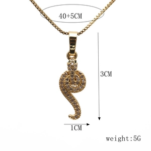 Detailed view of gold snake pendant with cubic zirconia, dimensions 3x1cm, weight 5g
