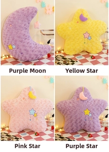 Collection of plush moon and star pillows with embroidered patterns and soft fabric