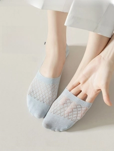Detail of light blue mesh invisible socks showing breathable diamond knit pattern