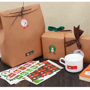 Christmas stickers with Santa and reindeer on gift boxes and kraft bags for holiday decor