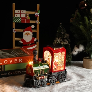 Macro view of glowing vintage steam train snow globe with warm lights and Santa Claus