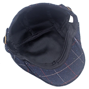 Detail of ivy cap showing blue windowpane plaid pattern and corduroy inner lining