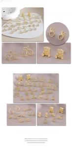 Detailed macro view of fashion gold plated animal stud earrings with crystal accents