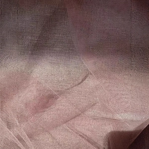 Women's layered mesh maxi skirt in dusty pink showing detailed texture and sheer fabric