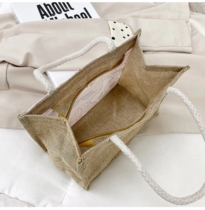 Detailed interior of jute tote bag with zipper pocket and cotton rope handles