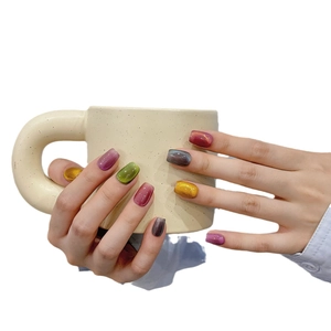 Handmade cat-eye press-on nails in candy colors with glossy summer glass finish