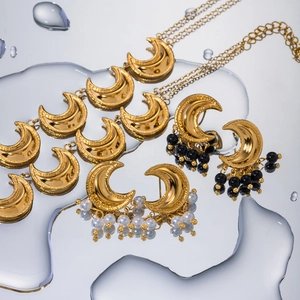 Polished 18k gold-plated stainless steel moon pendant earrings with pearls and black beads