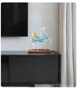 Macro detail of resin horse statue with golden ingot on dark wood base for desk decor
