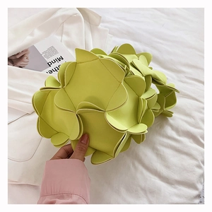 Detailed view of the neon green 3D floral petal handbag made from soft PU material