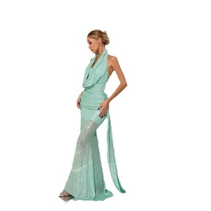 Mint green sequin halter neck evening gown with backless mermaid floor-length silhouette