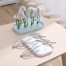Detail of expandable plastic bottle drying rack with cactus shaped support hooks