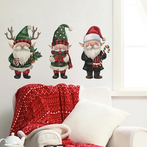 Cozy living room scene with Christmas gnome wall stickers above a red blanket sofa
