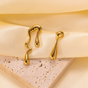 Elegant gold titanium steel earrings with asymmetric liquid metal design on silk and stone