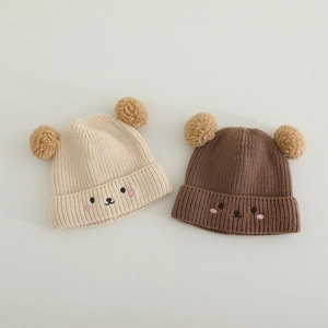 Cute knitted baby winter hats with bear embroidery and double poms in beige and brown