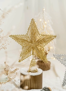 Detail of gold glitter star tree topper with spiral base for Christmas decoration