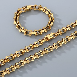 Detail showing the gold stainless steel bamboo link chain necklace and bracelet set