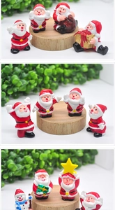Detailed close-up of miniature resin Santa and snowman figurines for Christmas decor