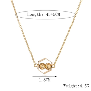 Detailed view of the gold necklace with pendant size 1.8cm and chain length 45+5cm