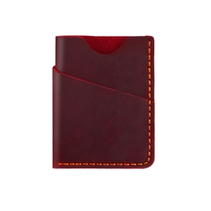 Macro shot of burgundy crazy horse leather card holder with hand-stitched orange thread