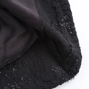 Elegant backless black evening gown featuring shimmering sequin texture and slim fit