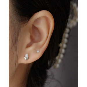 Elegant S925 silver heart stud earrings with sparkling crystals worn by a female model
