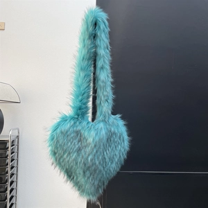 Detail of Tiffany blue faux fur heart-shaped bag with fluffy shell texture