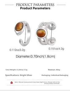 Detail view of silver alloy open rings with tiger eye stones showing 1.8cm inner diameter