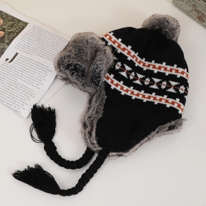 Knitted trapper hat with leopard pattern and faux fur lining for winter warmth
