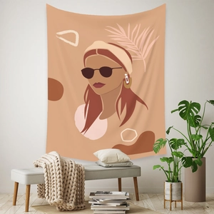 Bohemian tapestry featuring a stylish woman portrait and palm leaves in a cozy room