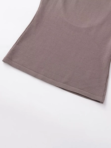 Close-up of the taupe knit fabric hem showing the fine stitching and texture detail