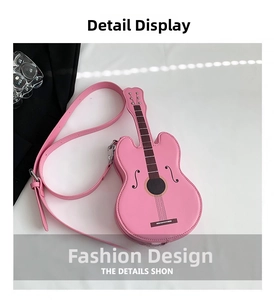 Detail shot of pink guitar-shaped PU leather bag with printed strings and silver metal hooks