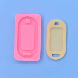 Pink and beige oval silicone molds for DIY resin tags and cake fondant crafts