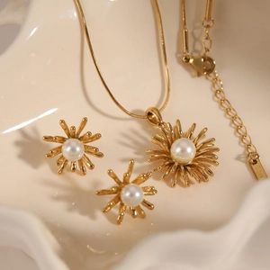 Parure collier et boucles d'oreilles en acier avec perles et design feu d'artifice