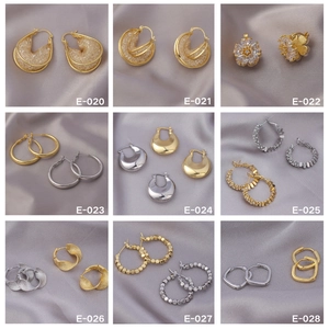 Collection of gold and silver plated earrings in geometric, floral and droplet designs
