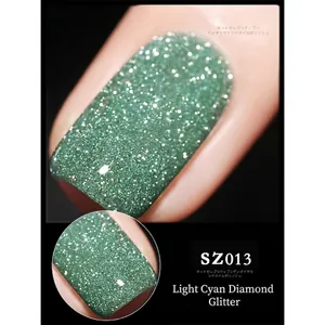 Macro detail of pale green diamond glitter gel nail polish with intense reflective shine