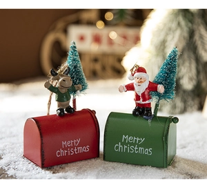 Detail of red and green miniature Christmas mailboxes with Santa Claus and reindeer décor