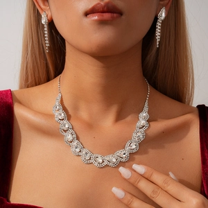 Exquisite rhinestone teardrop necklace and tassel earrings set for elegant evening wear