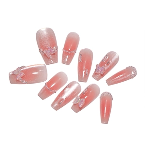 Sweet blush pink cat-eye press-on nails with 3D butterfly and pearl decorations