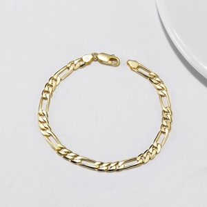 Golden S925 sterling silver 5mm Figaro chain bracelet with lobster clasp on white background