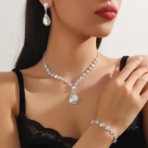 Detail of luxury teardrop AB crystal jewelry set worn by a model in studio lighting