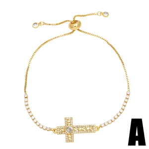 Adjustable gold cross bracelet with sparkling zircons and a secure sliding clasp