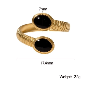Detail of gold-plated ribbed ring featuring two oval black stones with dimension labels
