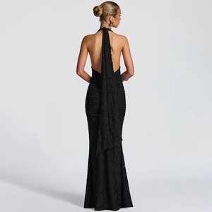 Elegant black backless evening dress with plunging V-neck and long ribbon tie details