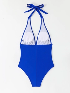 Detail of royal blue halter one-piece swimsuit with V-neck and removable pads