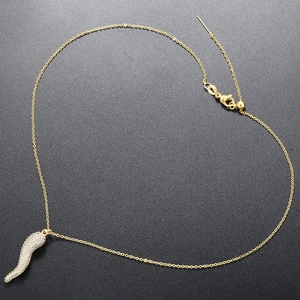 Close-up of 18K gold-plated chili pepper pendant with sparkling pavé cubic zirconia
