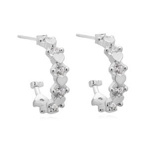 Close-up of S925 sterling silver stamp on hoop earrings with heart charms and zircon