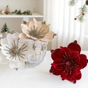 Elegant artificial Christmas poinsettia flowers with velvet petals and glitter decoration