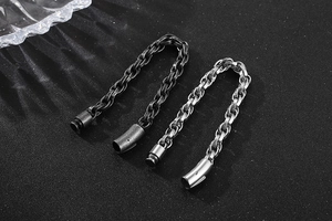 Detail of vintage oxidized titanium steel bracelet clasp in silver and black finishes